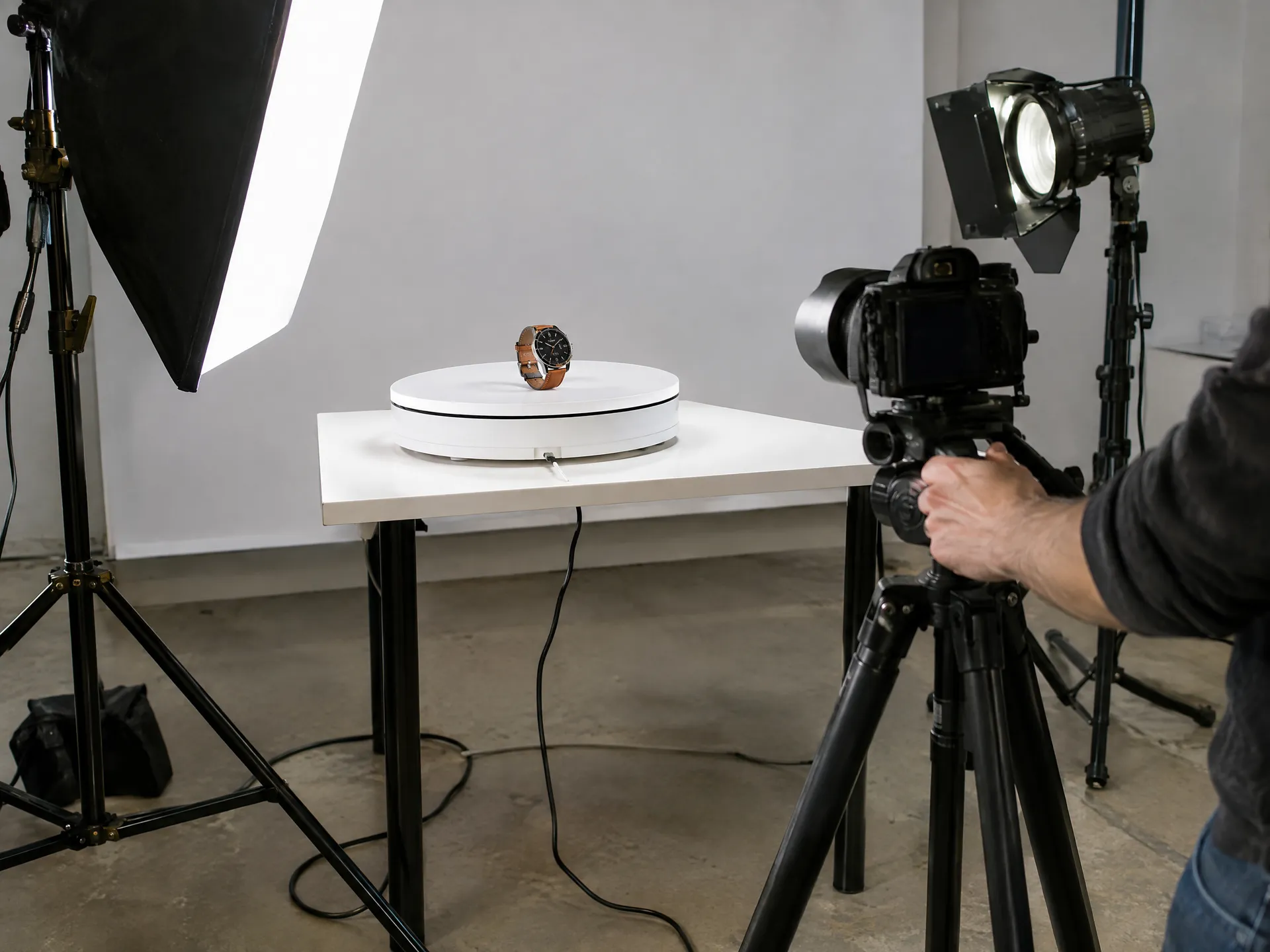 Studio turntable and camera rig being adjusted for a product shoot