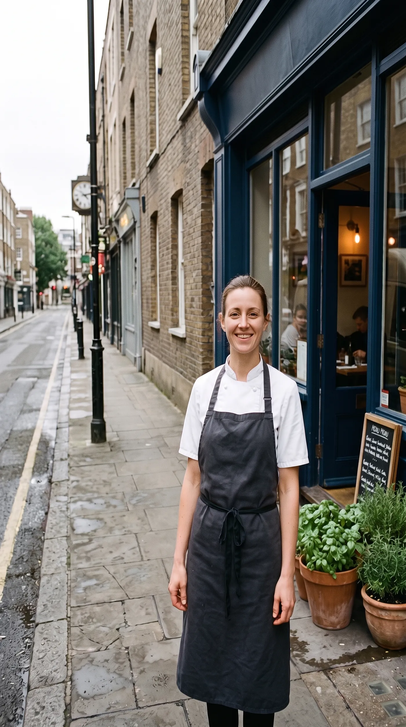 After: the same chef portrait on a clear sidewalk, with the van, staff, crates and bicycle removed by Background cleanup on getimg.ai