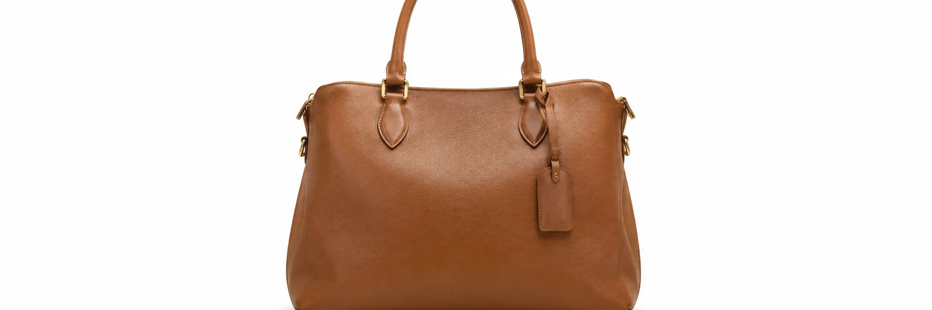 Tan leather handbag on a pure white seamless studio background with soft shadow