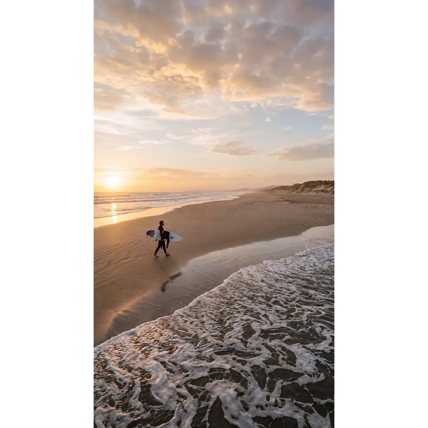 The surfer beach scene regenerated at 9:16 by Smart Resize on getimg.ai, the same width but a far taller frame with new sky, cloud and surf detail.