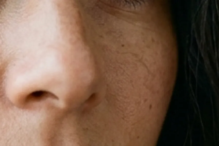 Portrait skin crop from a 1024px source scaled up with standard resampling