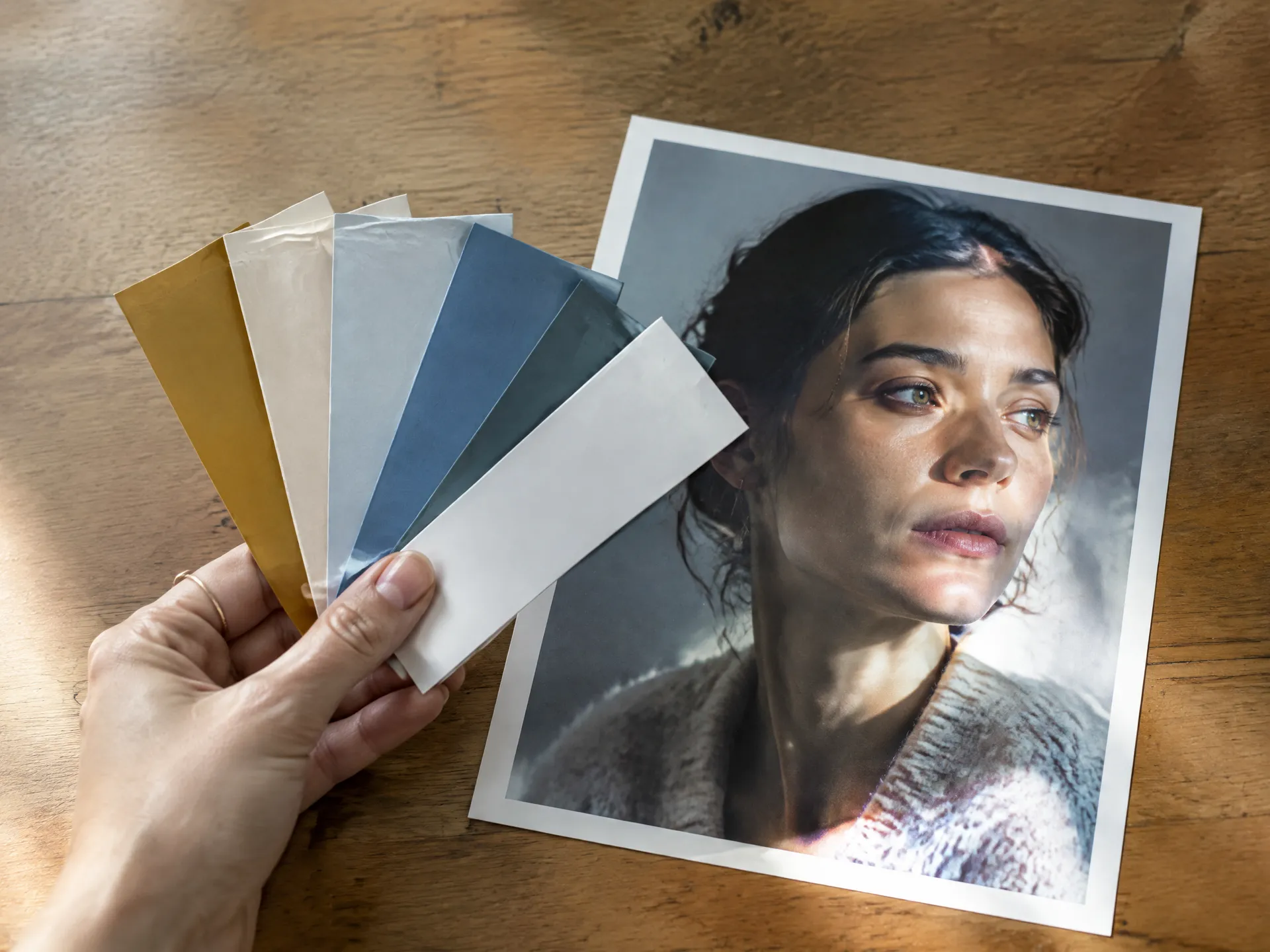 Paint swatches compared against a printed portrait photo