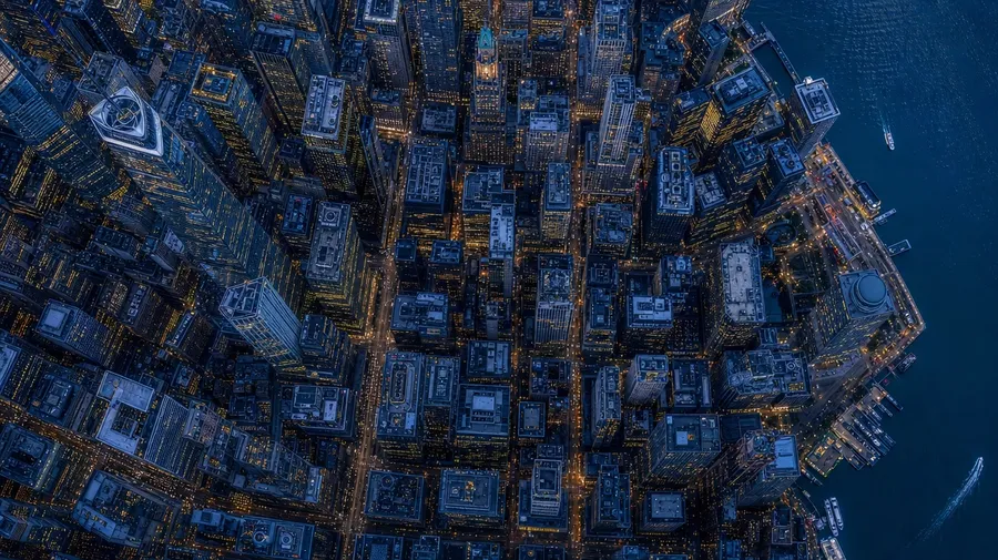 Top-down Manhattan financial district aerial at blue hour — AI-generated aerial stock image.