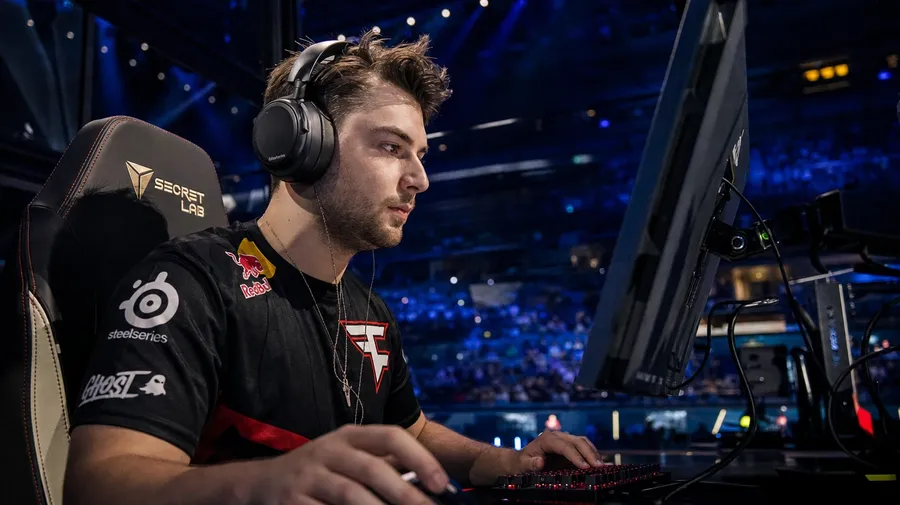 Pro esports player mid-tournament at a stadium-lit battlestation booth, AI-generated gaming images stock photo.