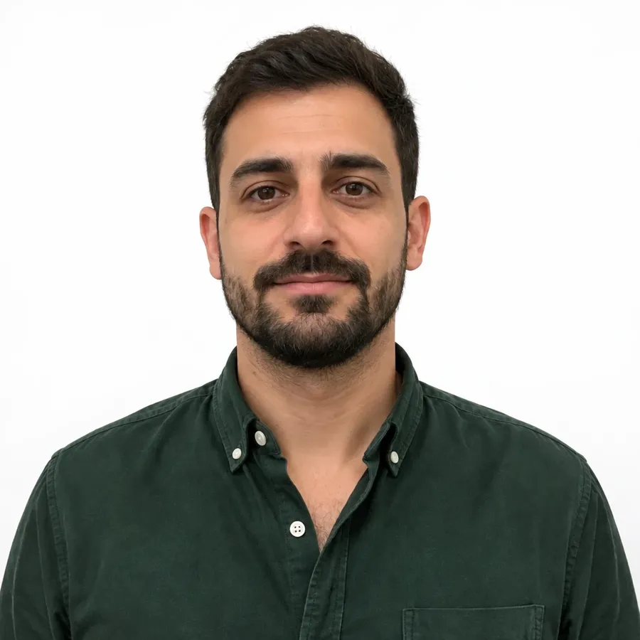 Man in a green shirt on a clean white studio sweep, one of four backgrounds from one source photo on getimg.ai