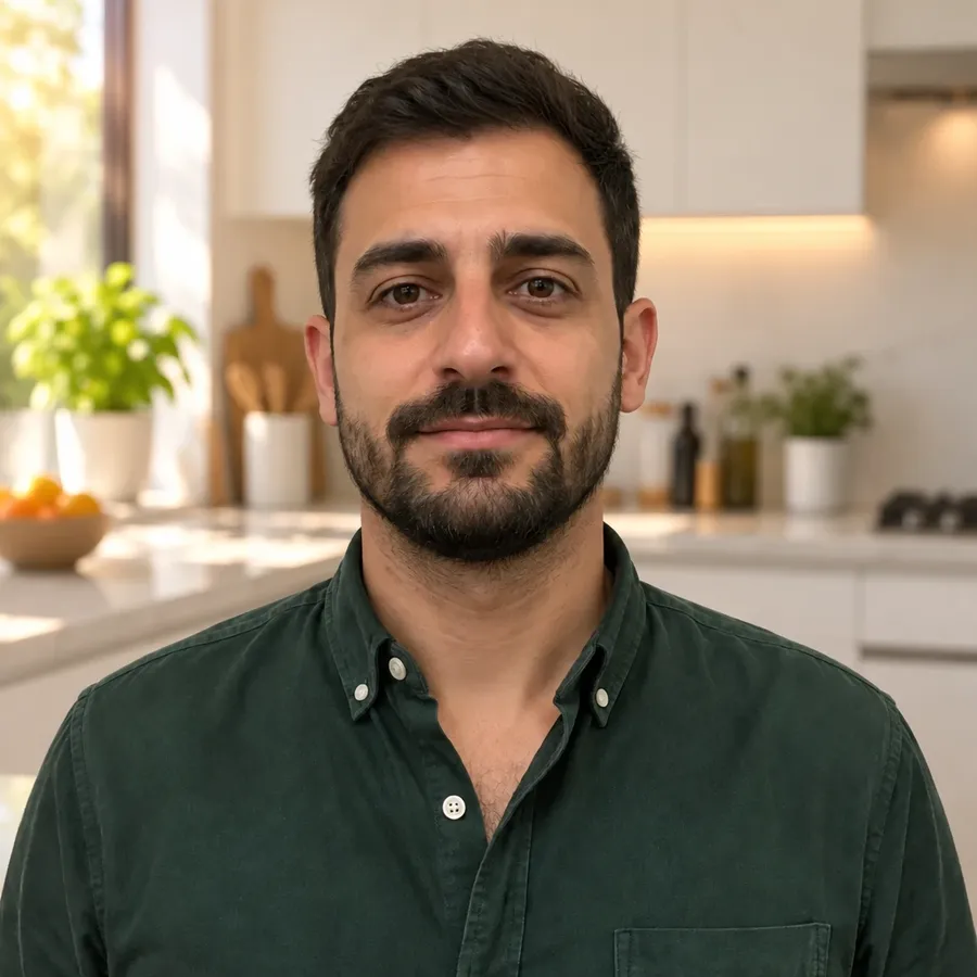 Man in a green shirt at a sunlit kitchen counter, one of four backgrounds from one source photo on getimg.ai