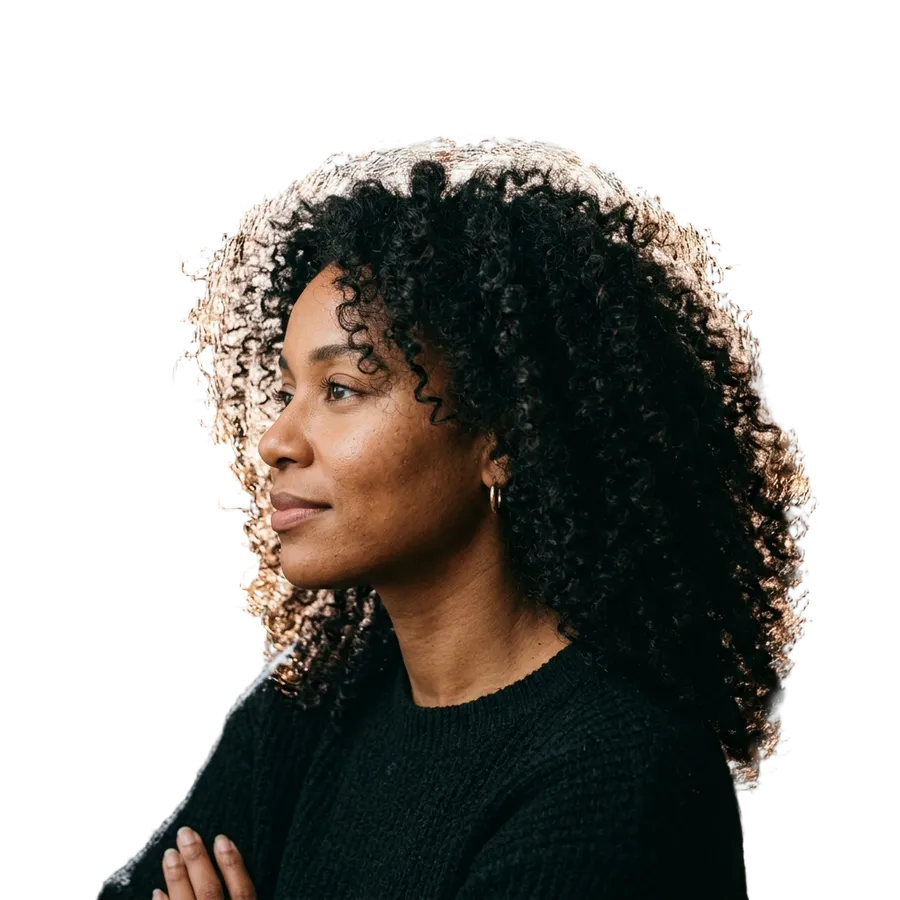 The same curly-haired portrait with the bookshelf removed and individual backlit strands preserved against transparency, background removed with getimg.ai