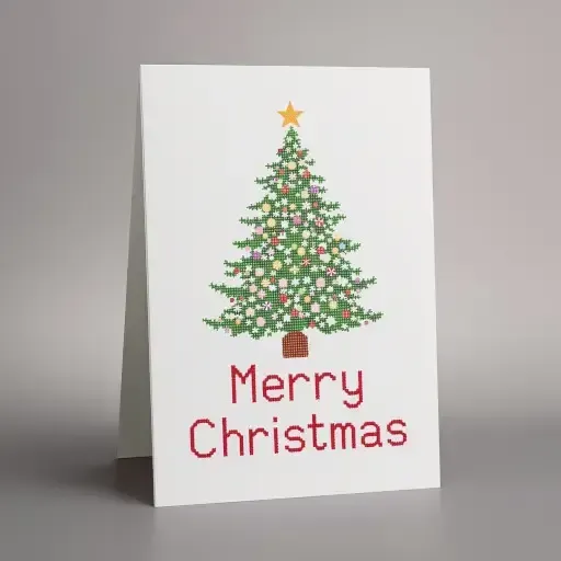White Christmas card with a decorated green tree and red Merry Christmas lettering.