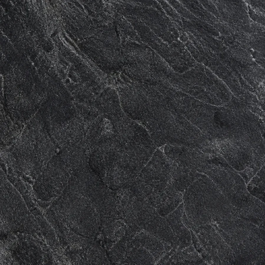 close-up macro texture shot of dark stone surface, soft studio lighting, realistic material detail, generated on getimg.ai